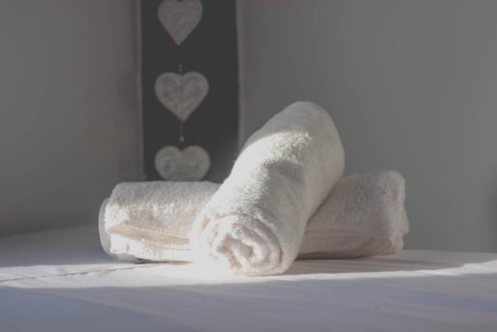 Postel nebo postele na pokoji v ubytování DAHLIA Guesthouse