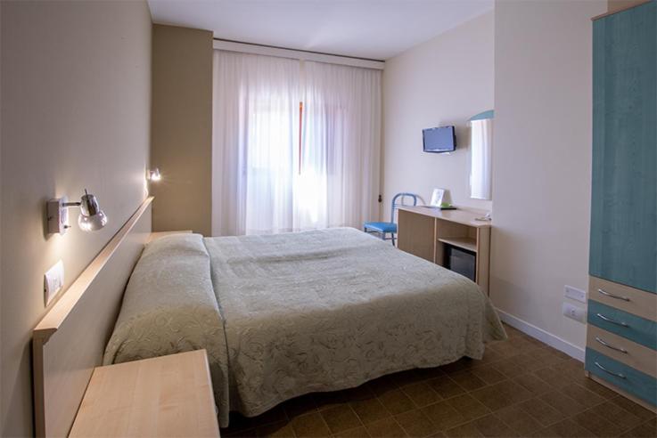 Postel nebo postele na pokoji v ubytování Hotel Scacciapensieri