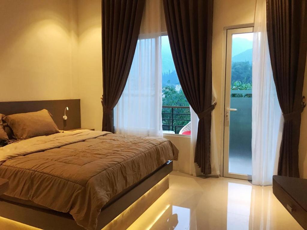 Postel nebo postele na pokoji v ubytování villa view2 sayriah