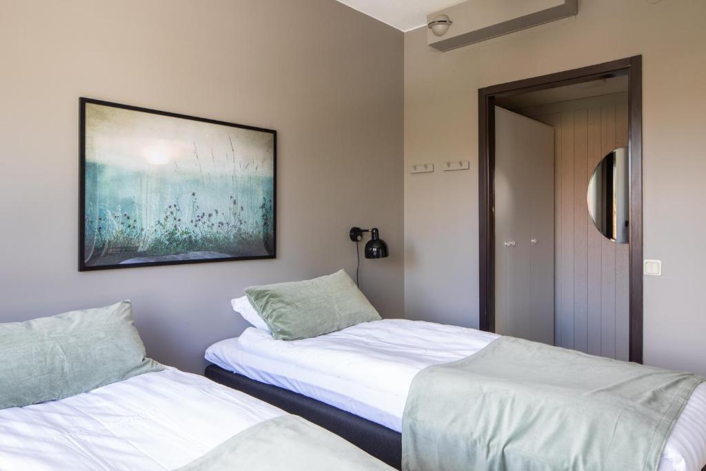 Postel nebo postele na pokoji v ubytování Hotel B&B Gränden