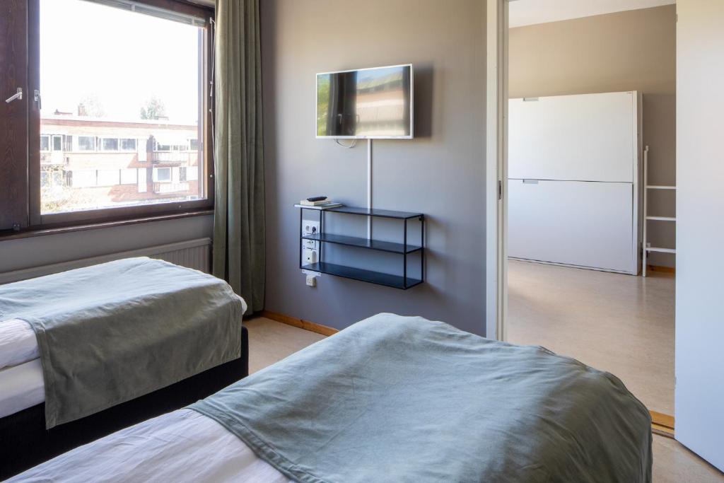 Postel nebo postele na pokoji v ubytování Hotel B&B Gränden