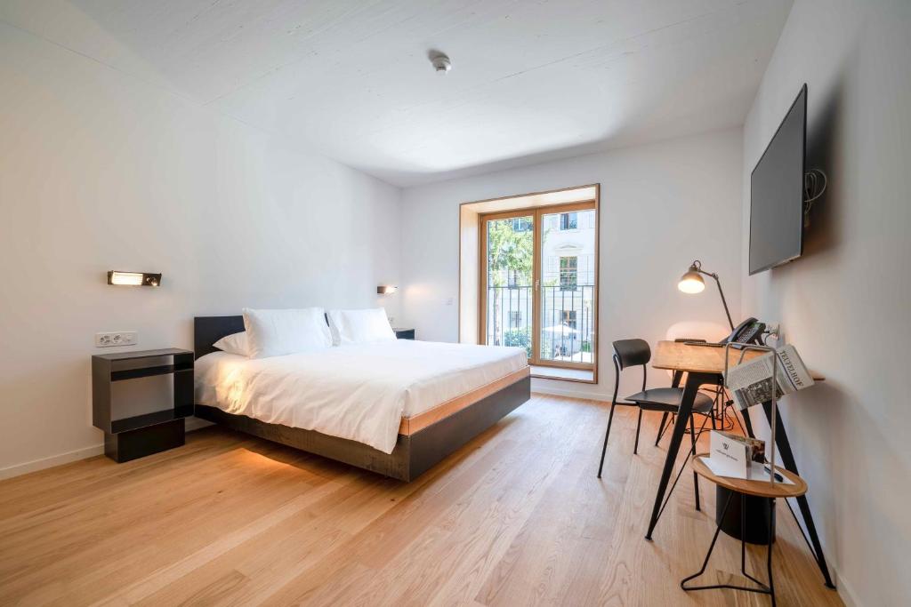 Letto o letti in una camera di SET Hotel.Residence by Teufelhof Basel