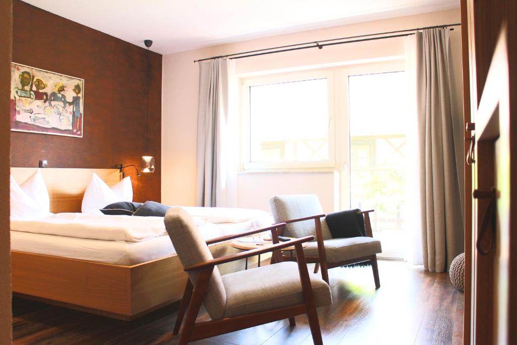 Postel nebo postele na pokoji v ubytování WeinHotel Fritz Walter
