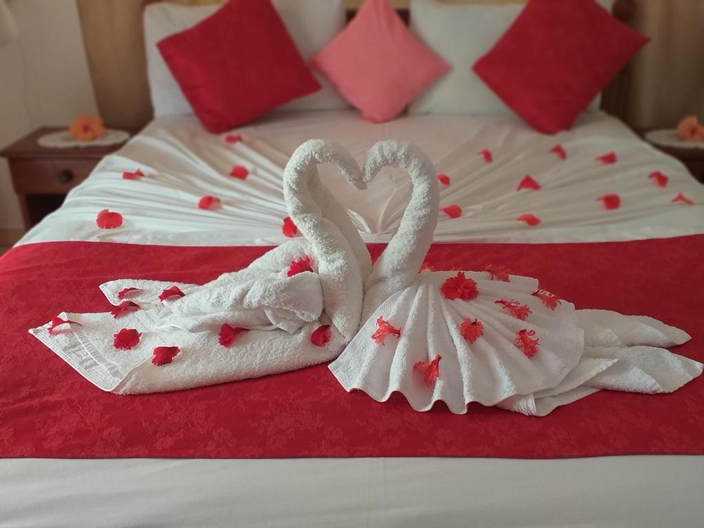 Postel nebo postele na pokoji v ubytování Pension Hibiscus