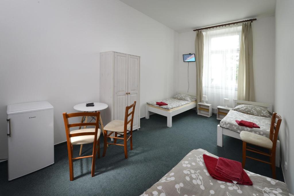 Postel nebo postele na pokoji v ubytování Penzion Pivovar Podlesí