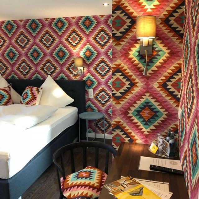 Postel nebo postele na pokoji v ubytování Hotel zur goldenen Sonne