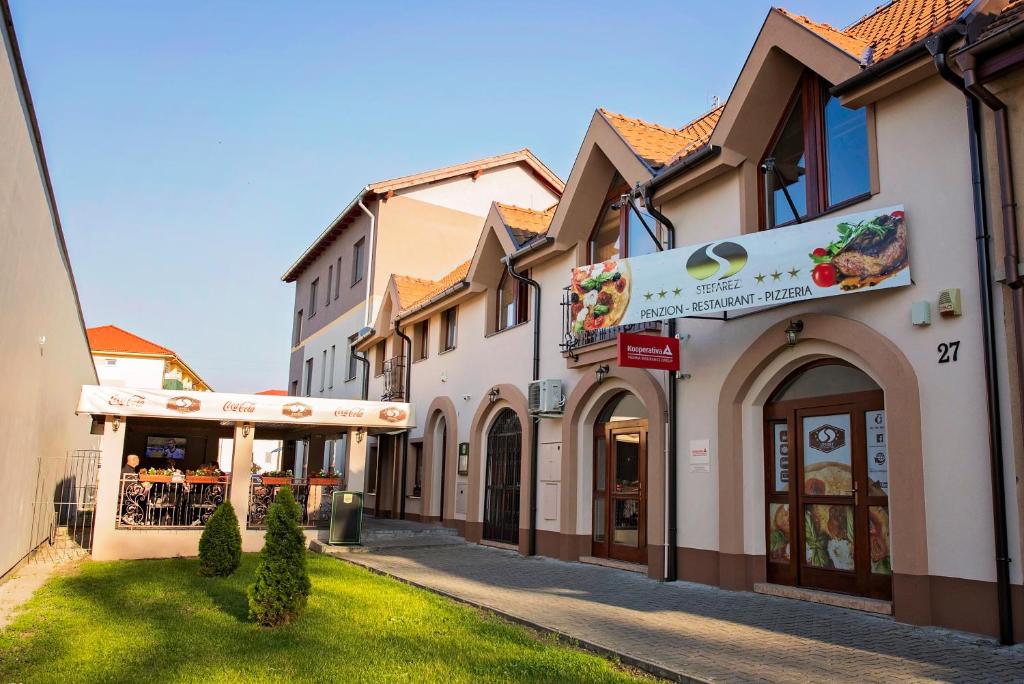 a row of buildings on a street at Penzión Stefarez New in Veľký Meder