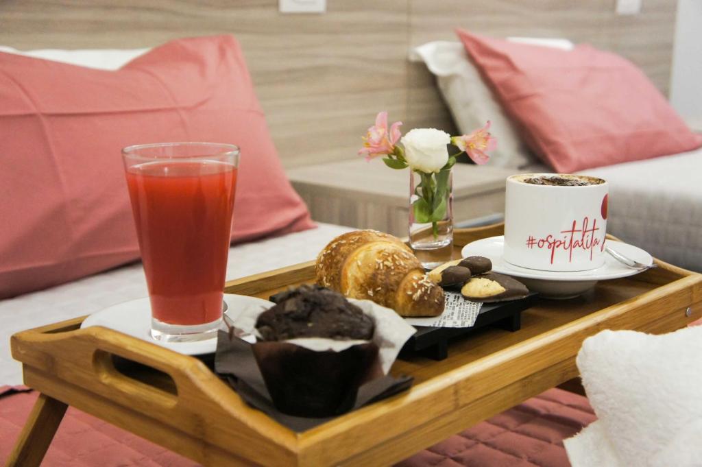 a coffee table with a tray of food and a drink at Albergo D'Onofrio in Telese