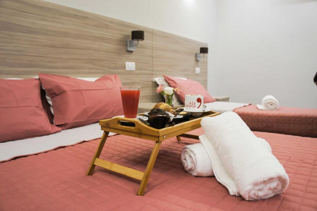 Postel nebo postele na pokoji v ubytování Albergo D'Onofrio