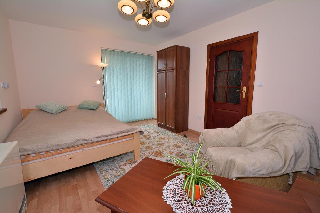 Posteľ alebo postele v izbe v ubytovaní Apartament Kosista