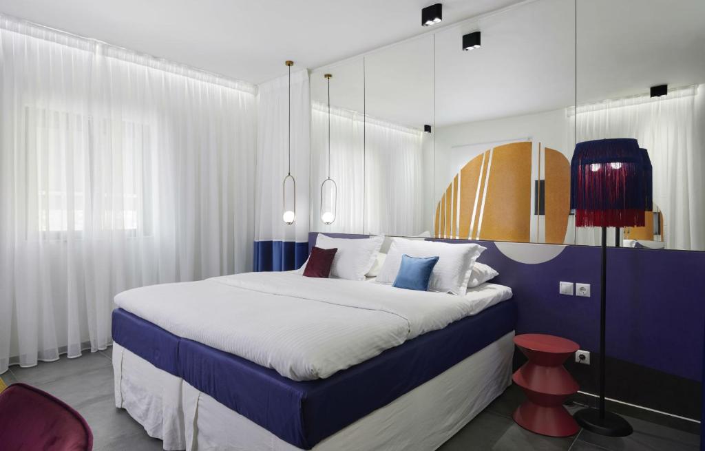 Thomais Boutique Hotel tesisinde bir odada yatak veya yataklar