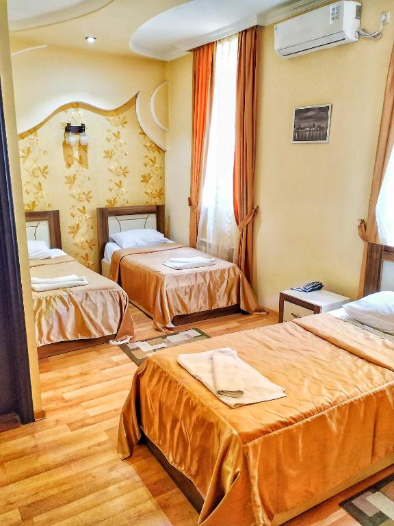 Postel nebo postele na pokoji v ubytování Lux Palace Hotel