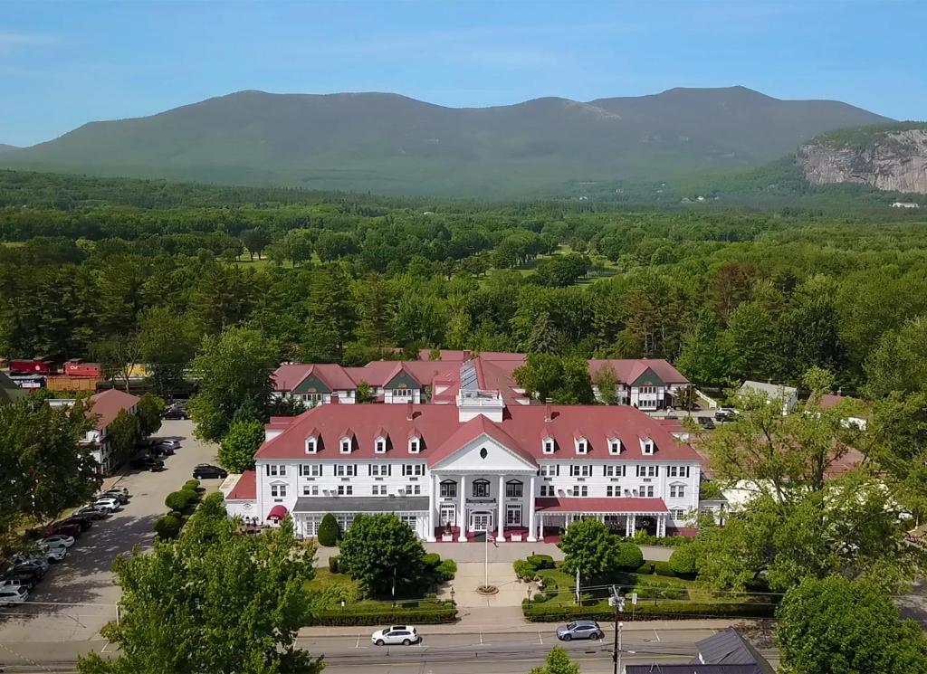 an aerial view of a large white building with a red roof at Eastern Slope Inn Resort in North Conway