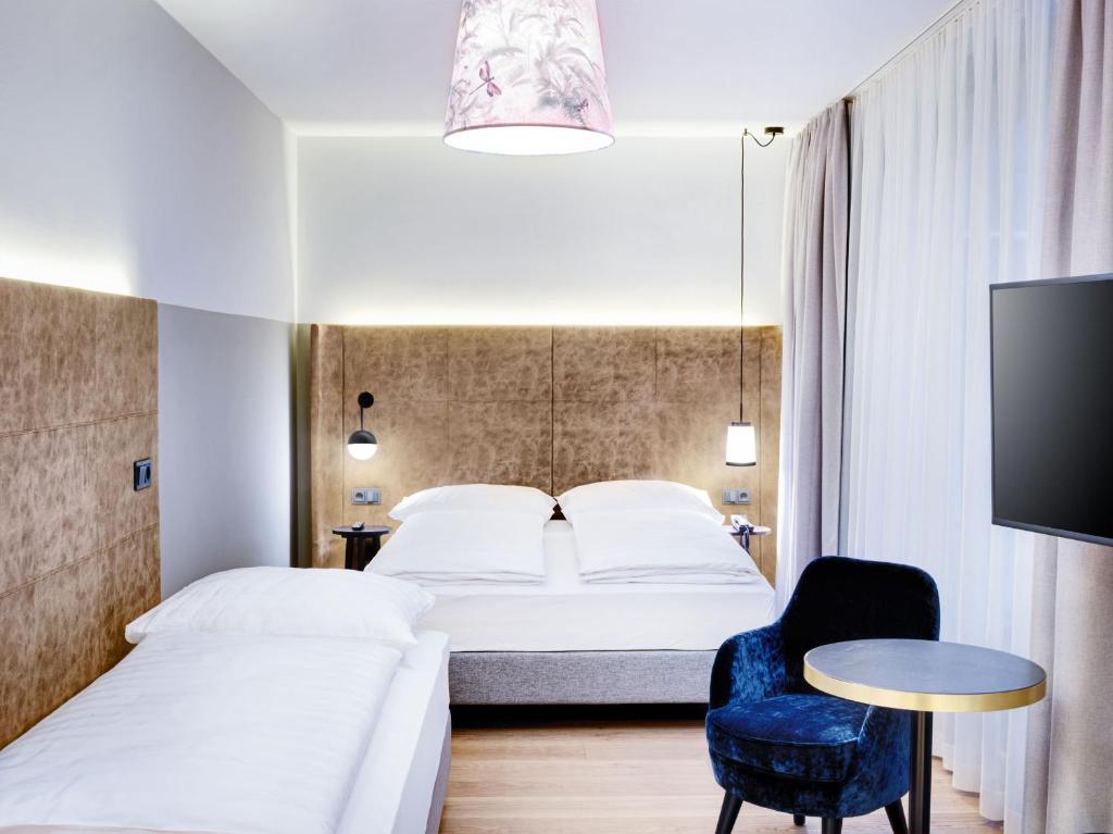 Postel nebo postele na pokoji v ubytování STAGE 12 Hotel by Penz