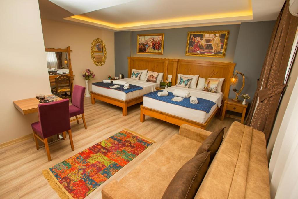 Postel nebo postele na pokoji v ubytování The PeraPort Hotel