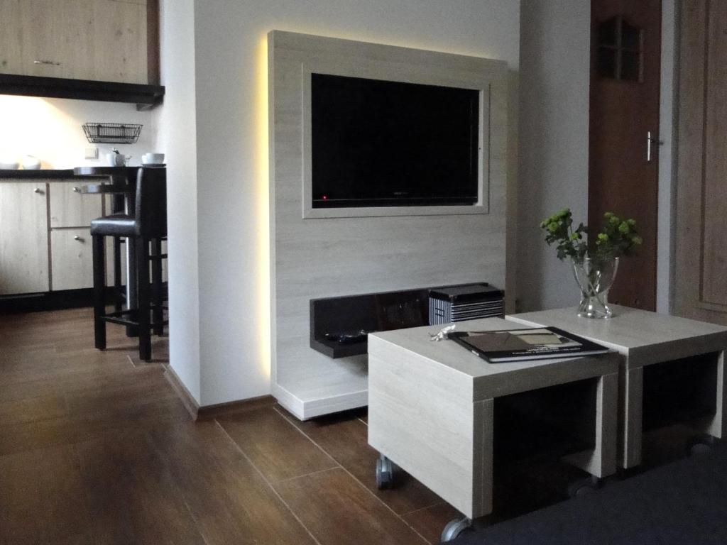 TV a/nebo společenská místnost v ubytování Arte-locum Apartamenty przy Rynku
