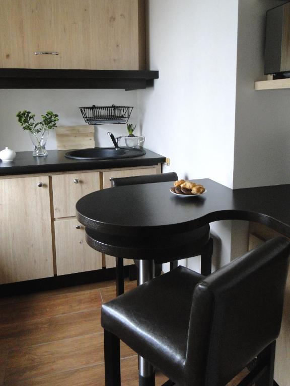 Kuchyň nebo kuchyňský kout v ubytování Arte-locum Apartamenty przy Rynku