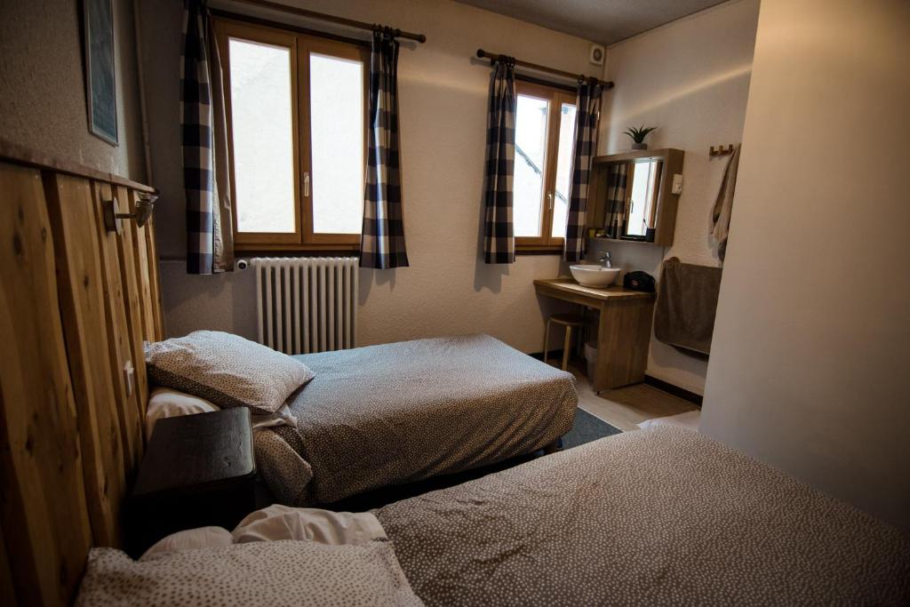 Postel nebo postele na pokoji v ubytování GITE LES GUIBERTES