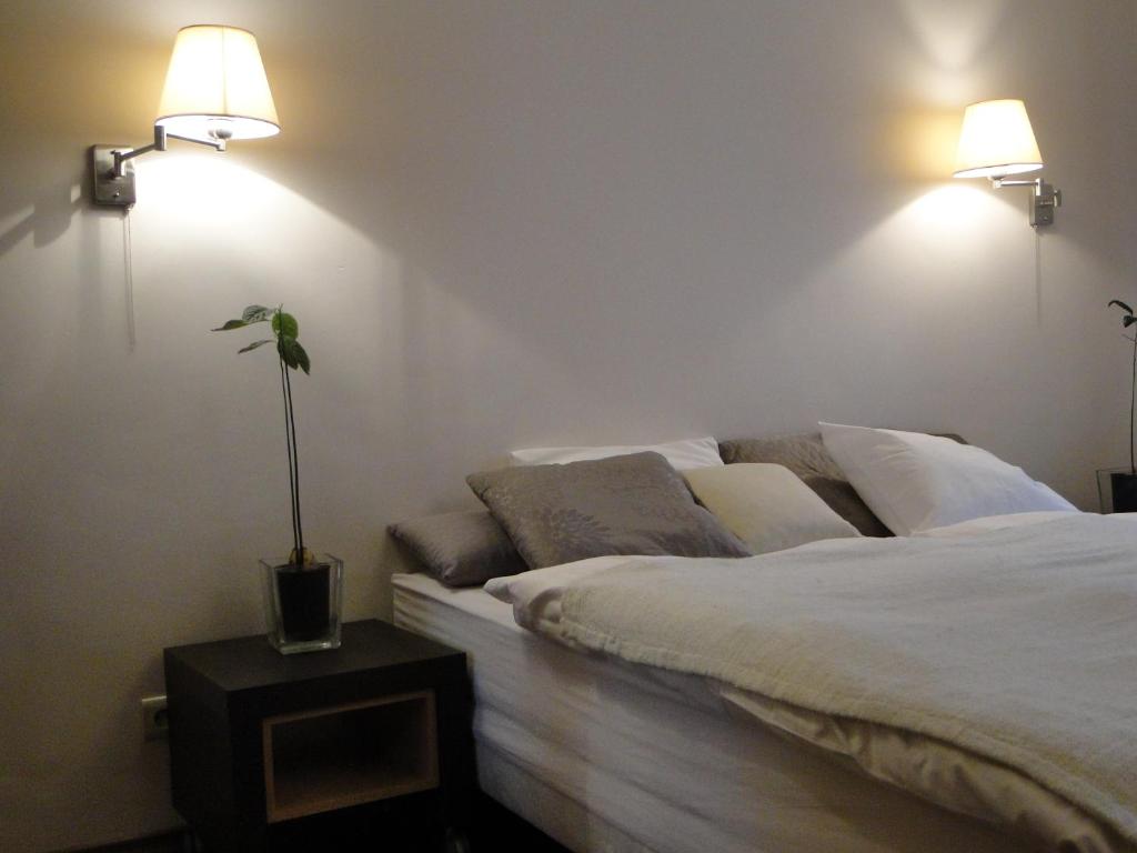 Postel nebo postele na pokoji v ubytování Arte-locum Apartamenty przy Rynku