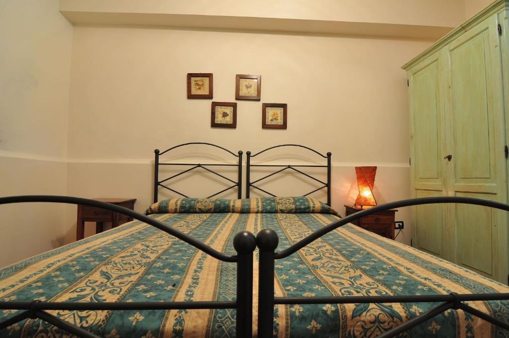 Postel nebo postele na pokoji v ubytování Agriturismo La Dimora dei Cavalieri