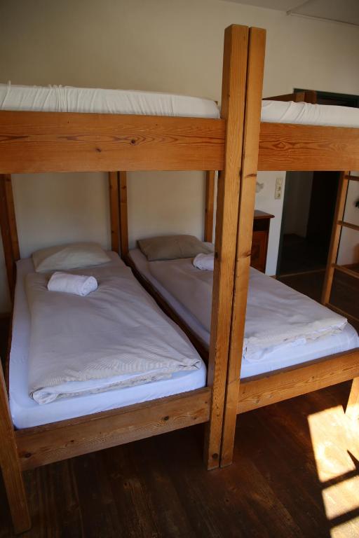 Postel nebo postele na pokoji v ubytování Hotel Schwarzer Adler Sillian