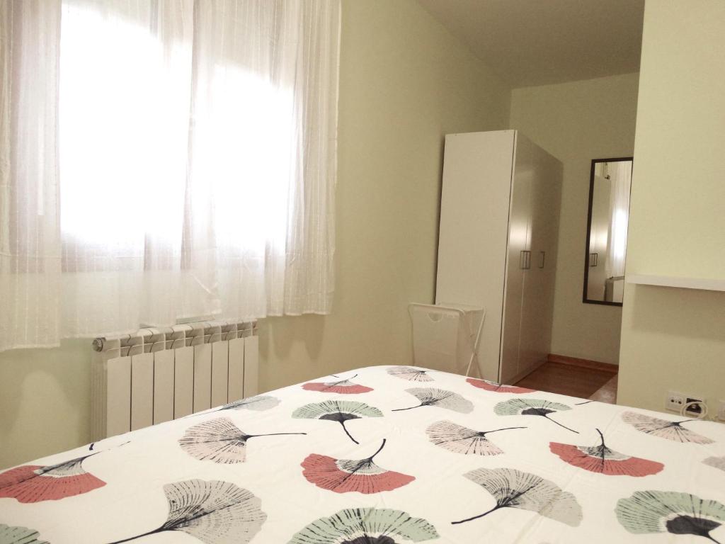 Postel nebo postele na pokoji v ubytování Apartamento del Rosario