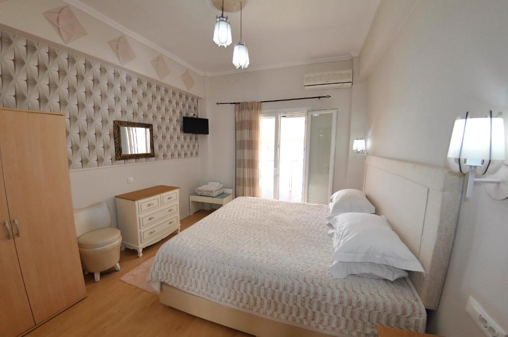 Postel nebo postele na pokoji v ubytování Tango Apartment On The Beach