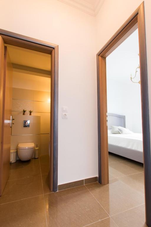 Postel nebo postele na pokoji v ubytování Poseidon Luxury Apartment
