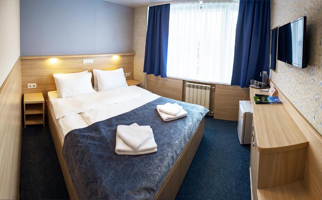 Postel nebo postele na pokoji v ubytování Truskavets 365 Hotel