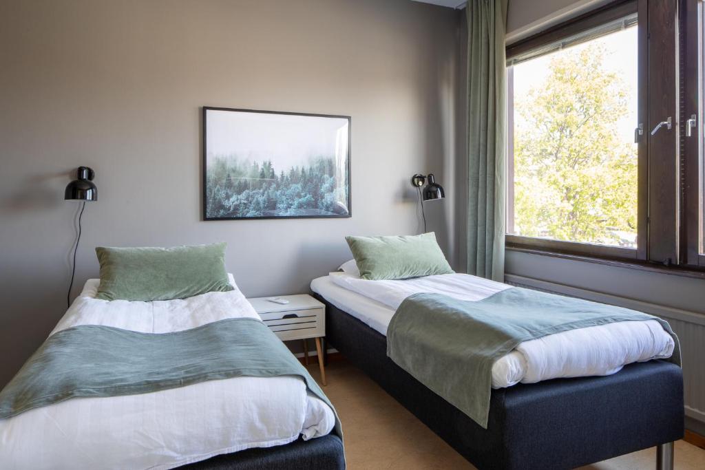 Postel nebo postele na pokoji v ubytování Hotel B&B Gränden