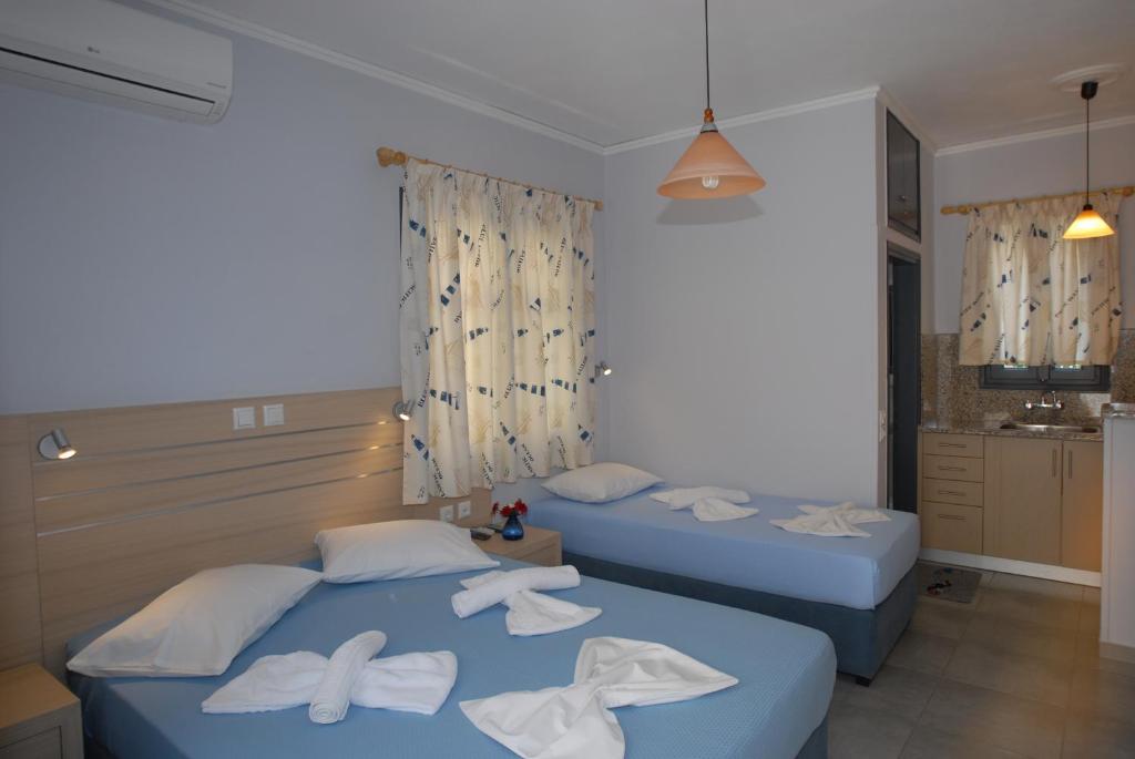 Letto o letti in una camera di Irene ROOMS & STUDIOS PETRA