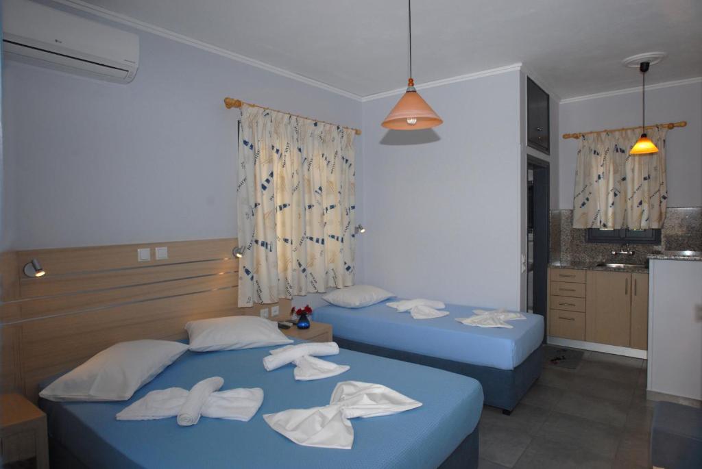 Letto o letti in una camera di Irene ROOMS & STUDIOS PETRA