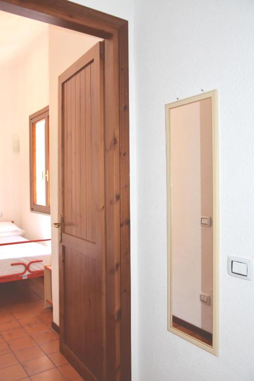 A bed or beds in a room at Domus Carlotta Apartment with sea view Villasimius