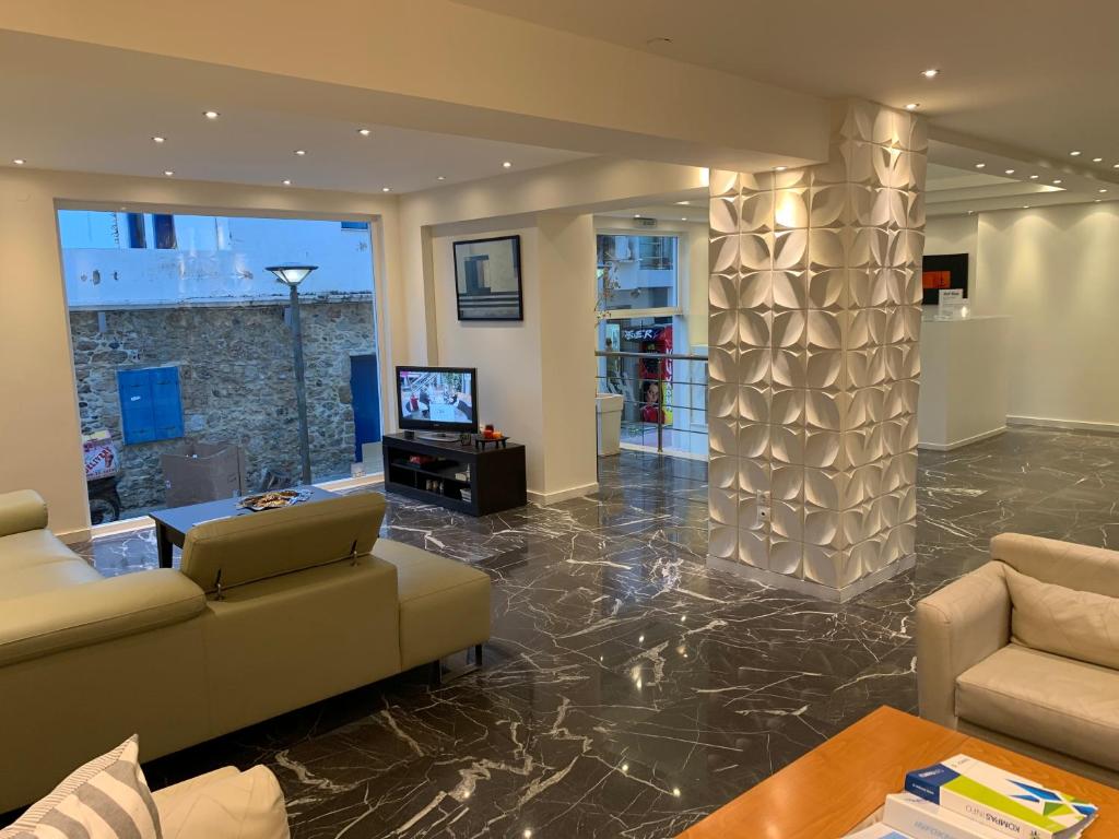 TV a/nebo společenská místnost v ubytování Nancy Hotel