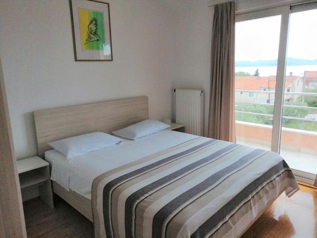 Postel nebo postele na pokoji v ubytování Apartments Rede