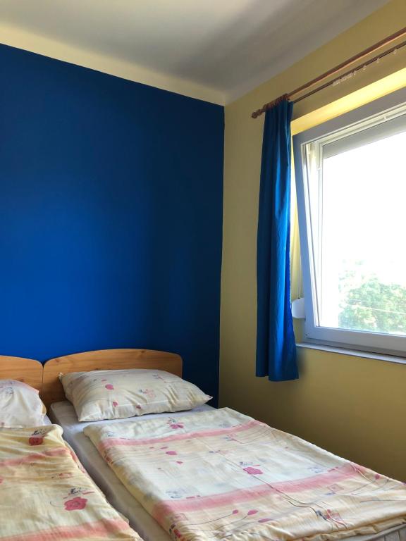 Postel nebo postele na pokoji v ubytování Matróz Siófok