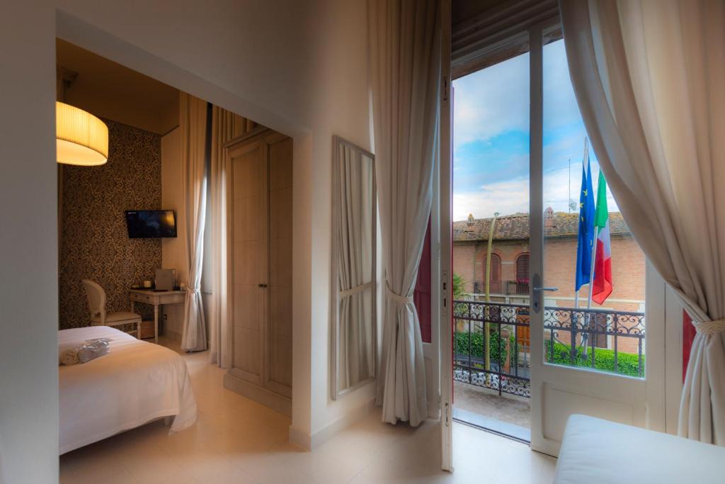 Posteľ alebo postele v izbe v ubytovaní Villa Elda Boutique Hotel