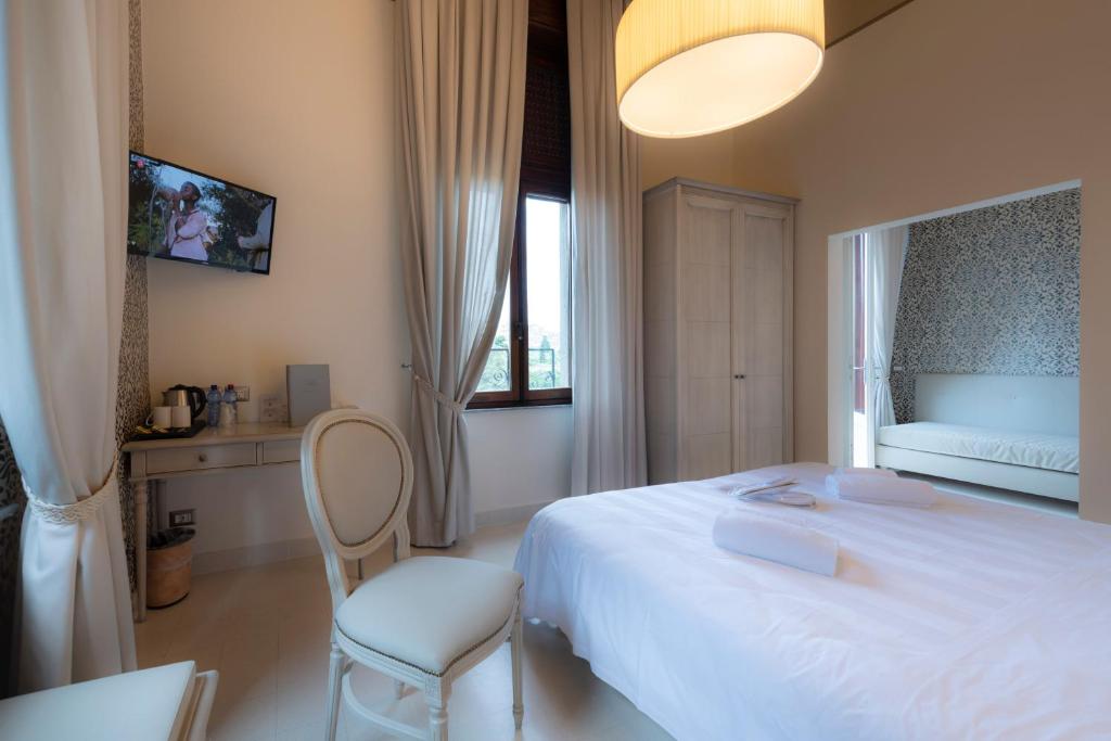 Posteľ alebo postele v izbe v ubytovaní Villa Elda Boutique Hotel