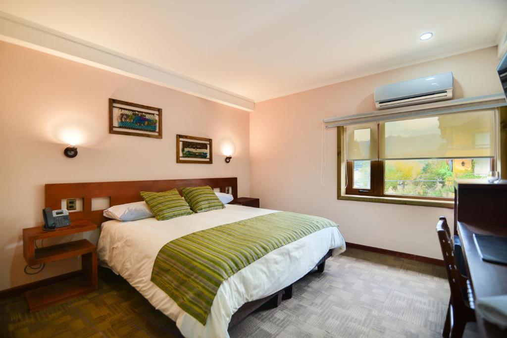 Cama o camas de una habitación en Hotel Pucón Indómito