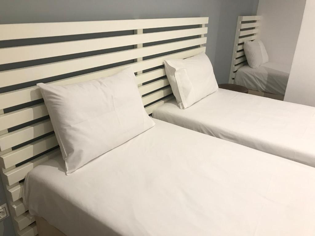 Postel nebo postele na pokoji v ubytování VIAL Rooms