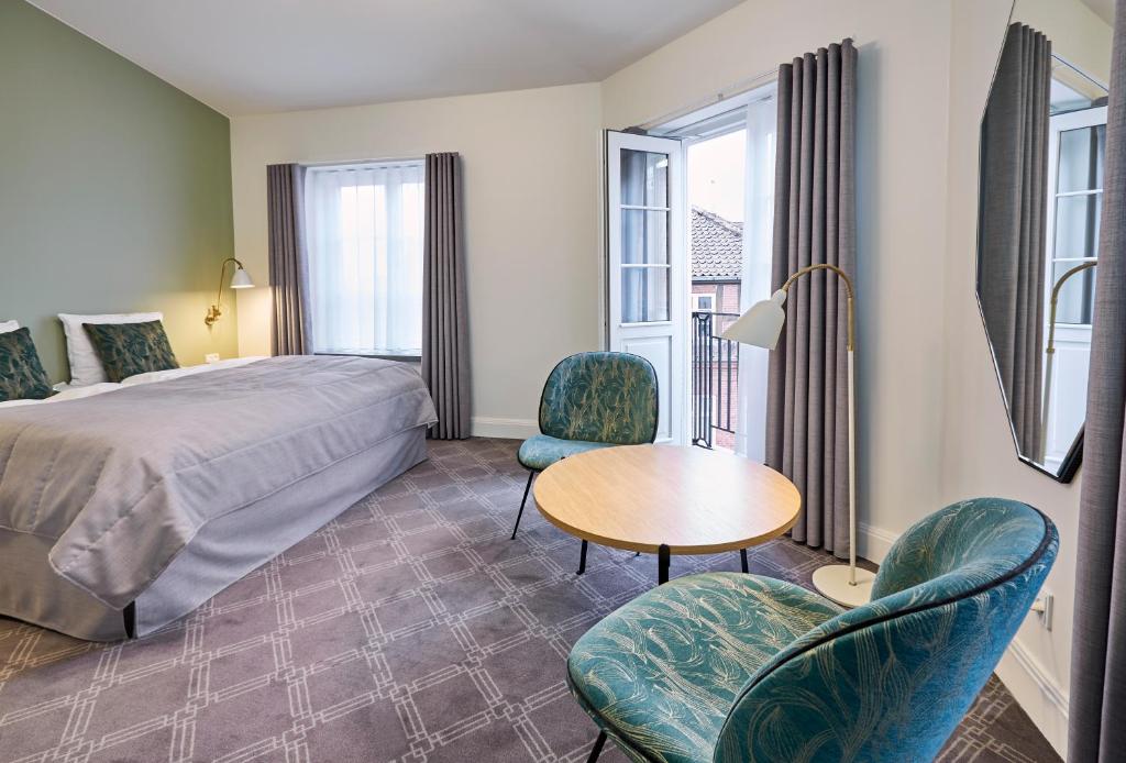 Ένα ή περισσότερα κρεβάτια σε δωμάτιο στο Hotel Randers