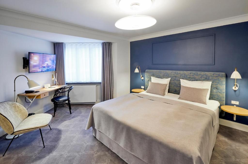 Ένα ή περισσότερα κρεβάτια σε δωμάτιο στο Hotel Randers