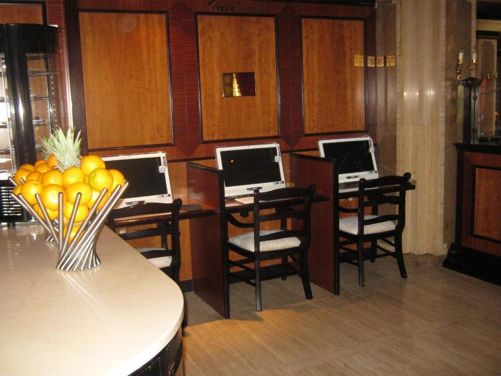 a room with four desks with computers on them at Gulf Inn Hotel Deira Formerly City Star Hotel in Dubai