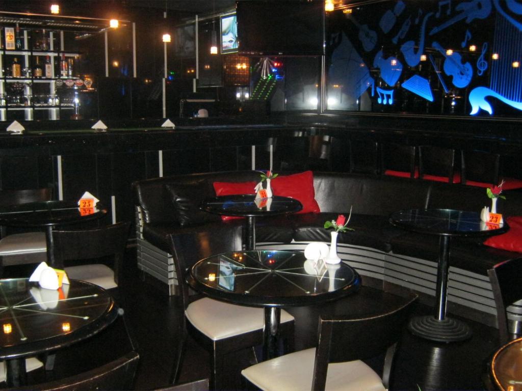 a restaurant with tables and chairs in a room at Gulf Inn Hotel Deira Formerly City Star Hotel in Dubai