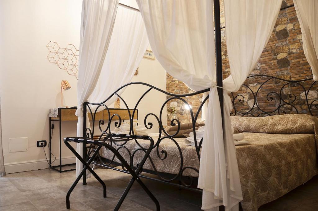 Postel nebo postele na pokoji v ubytování CASA FELICE Maison de Charme