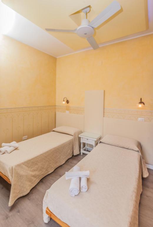 Postel nebo postele na pokoji v ubytování Albergo Della Corte