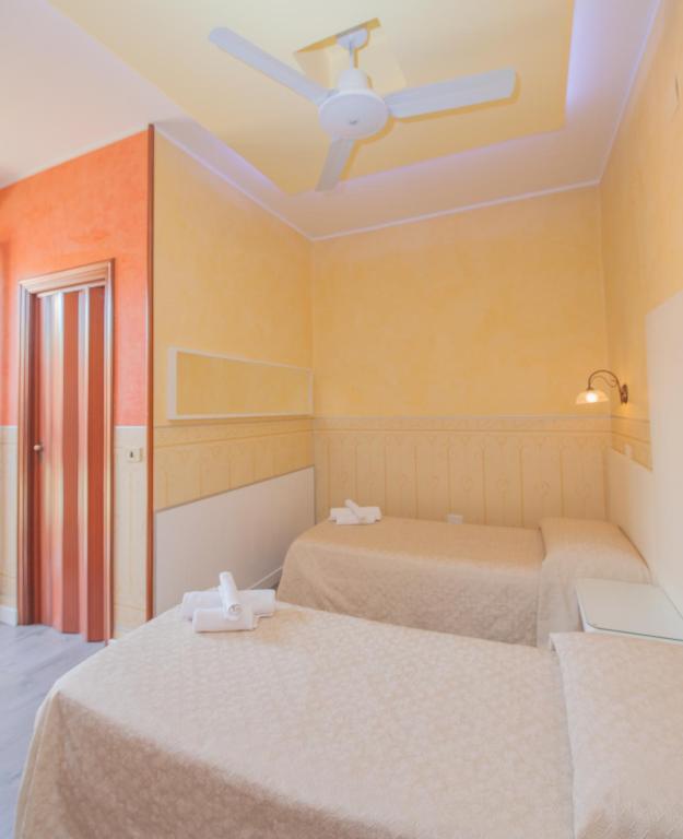 Postel nebo postele na pokoji v ubytování Albergo Della Corte