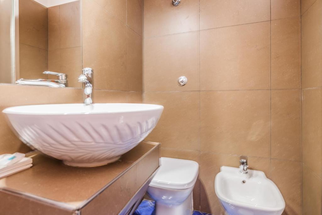 Koupelna v ubytování Albergo Della Corte