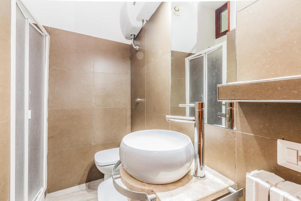 Koupelna v ubytování Albergo Della Corte