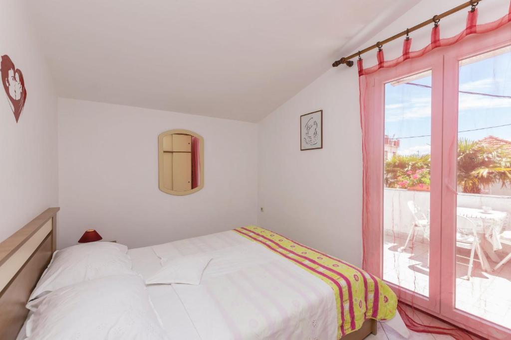 Posteľ alebo postele v izbe v ubytovaní Apartments Miroslava